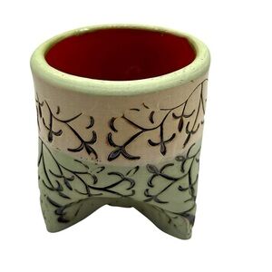 Green succulent planter w/Leaf signature. Red clay 3”x3” a distinct footed base